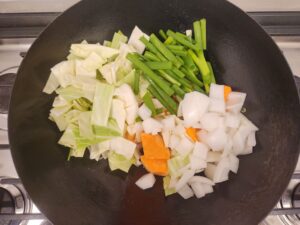 Vegetables heated in a wok