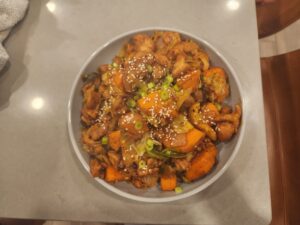 Stir-fry spicy Korean chicken in a bowl